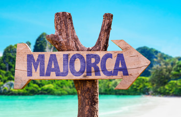 Majorca wooden sign with beach background