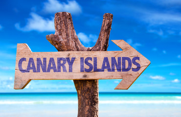 Canary Islands wooden sign with beach background