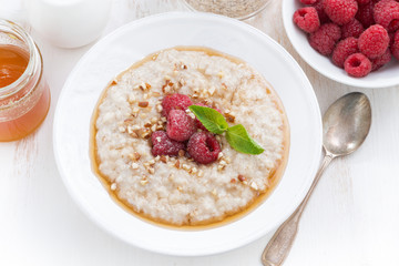 oatmeal with raspberries and honey, top view