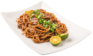 Popular Malaysian stir fried noodles on white plate