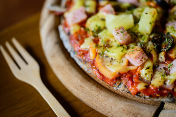 pizza Hawaiian thin crust pizza.