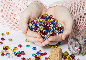 Woman hands holding origami stars