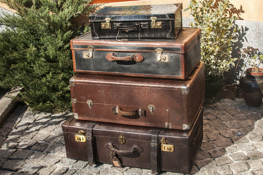 Old vintage used leather stacked suitcases