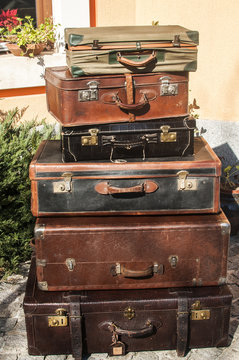 Old vintage used leather stacked suitcases