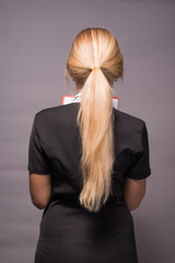 Naklejka premium back of girl with beautiful long blonde hair