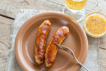 Grilled sausages with glass of beer