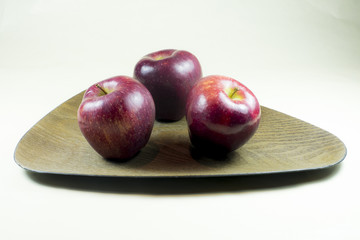 Red apples on a plate