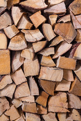 Fototapeta premium Wooden abstract background, stack of wood logs