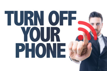 Business man pointing the text: Turn Off Your Phone