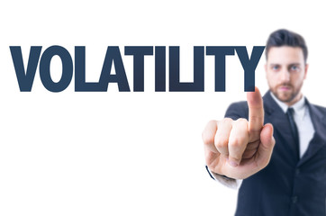Business man pointing the text: Volatility