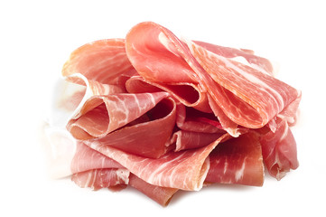 Italian prosciutto crudo ,raw ham leg sliced on white