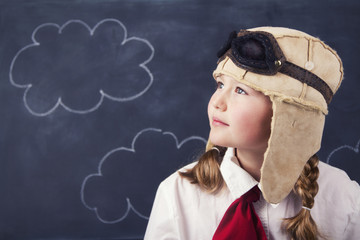 young girls with aviator goggles and hat