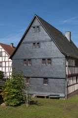 Fototapeta na wymiar Slate shingled wall at half-timbered house