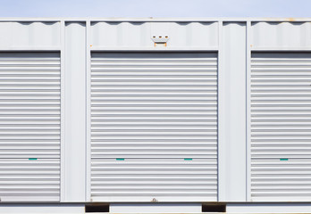 Obraz na płótnie Canvas Exterior of white storage unit or small warehouse for rental