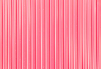 Pink corrugated metal background and texture surface.