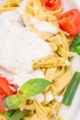 Spaghetti with tomato basil and cream.
