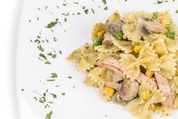 Pasta shells with vegetables and sausage.
