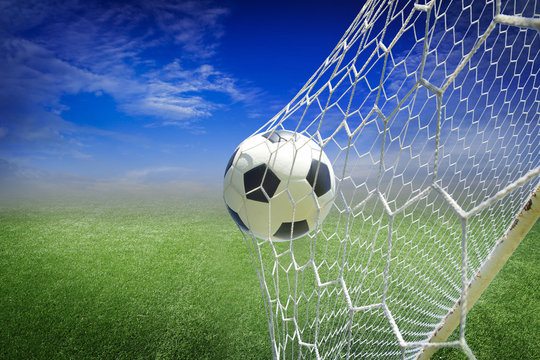Fototapeta soccer ball in goal