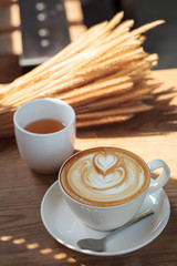 A cup of coffee latte and light breakfast