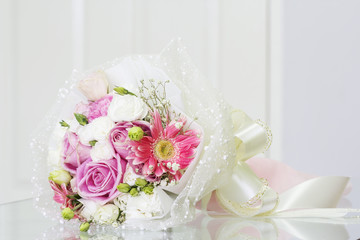 Bouquet on the glass table in living room