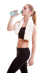 Young healthy girl with bottle of water in hands