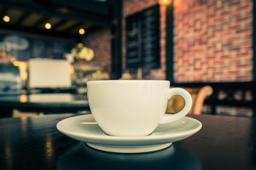 Coffee cup on the table at the coffee shop.