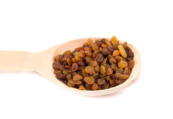 Wooden spoon with raisins.