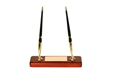 Two beautiful pens on red wooden stand.