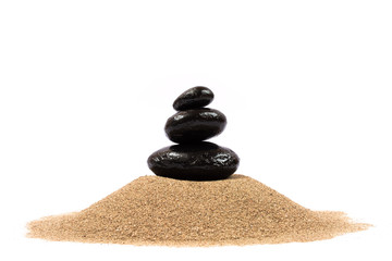 Relaxing on the beach, black stones on white background