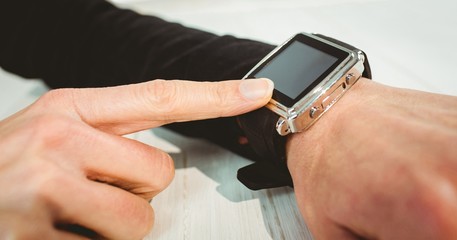 Businesswoman using a smart watch
