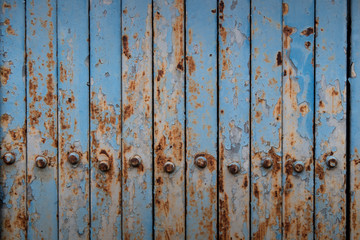 Rusted blue painted metal wall