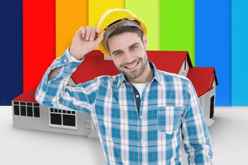 Composite image of confident male technicial wearing hard hat