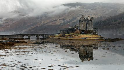 Eilean Donan Castle in misty morning, Highlands in Scotland