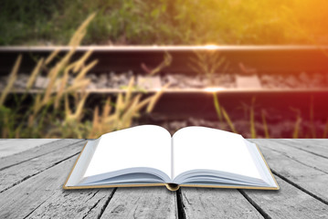 Open blank book with nature background