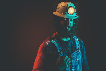 Miner Wearing Helmet Lamp Smoking Cigarette