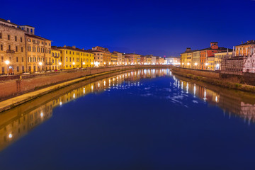 Fototapeta na wymiar City center of Pisa with reflection in Arno river, Italy