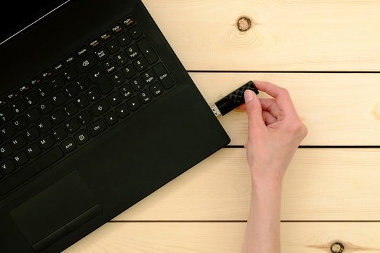 Hand Inserting Usb Memory Stick To Laptop Computer