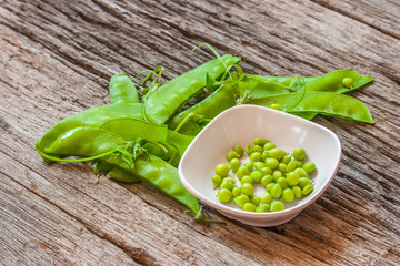 Bean in the cup on the wooden table