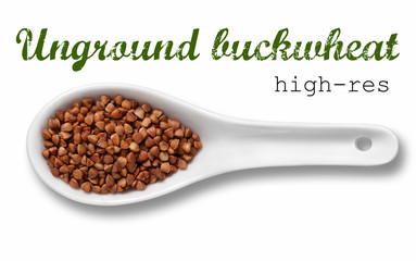 Unground buckwheat groats in white porcelain spoon