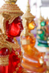 blurry defocused image of red buddha statue for background