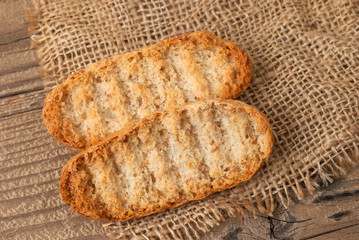 Rusks on old wooden table