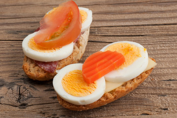Rusks sandwich on old wooden table