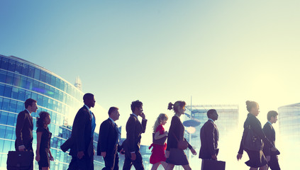 Group of Business People Walking Back Lit Concept