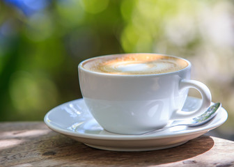 Cappuccino or latte coffee with heart shape.