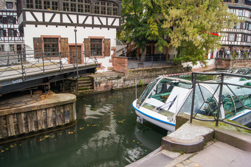 Fototapeta na wymiar Tourist boat in a narrow place in the river