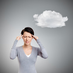 Upset girl tries to solve problems, isolated on grey background with cloud