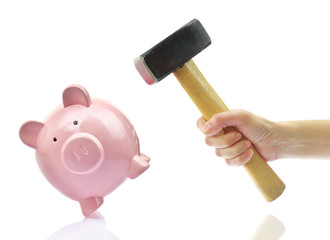 Hand with hammer and piggy bank, isolated on white