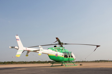 Fototapeta na wymiar helicopter standing on landing strip in airfield. Low angle view