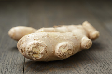 big piece of ginger root on wooden table