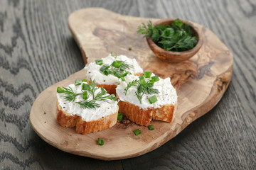 homemade appetizing crostini with soft cheese cream herbs